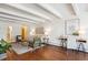 Charming living room with hardwood floors, stylish decor and a view of the dining room at 4801 E 9Th Ave # 402S, Denver, CO 80220