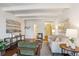 Relaxing living room with hardwood floors, exposed beam ceiling, comfortable seating and unique decor at 4801 E 9Th Ave # 402S, Denver, CO 80220