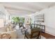 Bright living room featuring exposed beam ceiling, hardwood floors and comfortable seating at 4801 E 9Th Ave # 402S, Denver, CO 80220