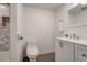 Bathroom view showcasing a luxurious tub with elegant marble tiling and a modern toilet at 14150 E Temple Dr # V06, Aurora, CO 80015