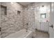 Gorgeous bathroom featuring a tub with stone tiling and a modern vanity with sleek fixtures at 14150 E Temple Dr # V06, Aurora, CO 80015