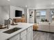 Open kitchen with quartz counters, stainless appliances, and sight lines to living room at 14492 Pansy Loop, Morrison, CO 80465