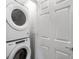 Efficient laundry area featuring a stacked washer and dryer set, maximizing space and convenience for laundry tasks at 14492 Pansy Loop, Morrison, CO 80465