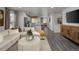 Open-concept space showcasing a living room connected to a kitchen with breakfast bar seating at 14492 Pansy Loop, Morrison, CO 80465