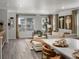 A bright living room featuring modern decor, large windows, and neutral color palette at 14492 Pansy Loop, Morrison, CO 80465