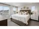 Bright main bedroom with neutral decor, carpet, and multiple windows at 14492 Pansy Loop, Morrison, CO 80465