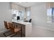 Bright home office with a large desk, comfortable seating, and window views providing an ideal workspace at 14492 Pansy Loop, Morrison, CO 80465