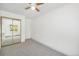 Inviting bedroom featuring plush carpet, a ceiling fan, and a large mirrored closet at 707 W 96Th Ave # 5, Thornton, CO 80260