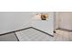 Open living area featuring tile flooring next to an open kitchen and large doorway at 707 W 96Th Ave # 5, Thornton, CO 80260