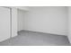 This bedroom is spacious and features neutral paint colors, baseboard trim, and a closet for storage at 3110 W 66Th Ave, Denver, CO 80221