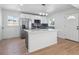 Modern kitchen with stainless steel appliances, ample counter space, and stylish cabinets at 3110 W 66Th Ave, Denver, CO 80221