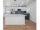 Modern kitchen with stainless steel appliances, ample counter space, and stylish cabinets at 3110 W 66Th Ave, Denver, CO 80221