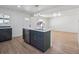 Modern kitchen with stainless steel appliances, ample counter space, and stylish cabinets at 3110 W 66Th Ave, Denver, CO 80221
