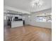 Bright and spacious living room featuring hardwood floors and modern lighting at 3110 W 66Th Ave, Denver, CO 80221