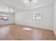 Bright and spacious living room featuring hardwood floors and modern lighting at 3110 W 66Th Ave, Denver, CO 80221