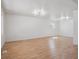 Bright and spacious living room featuring hardwood floors and modern lighting at 3110 W 66Th Ave, Denver, CO 80221