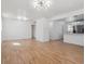 Bright and spacious living room featuring hardwood floors and modern lighting at 3110 W 66Th Ave, Denver, CO 80221