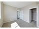 Bright bedroom with neutral walls, plush carpet, and a closet with an open door at 8722 E 47Th Ave, Denver, CO 80238