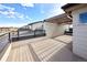 Modern deck area with a stylish pergola, perfect for outdoor living and relaxation at 8722 E 47Th Ave, Denver, CO 80238