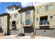 Modern townhome exterior featuring multiple levels and private balconies and attached garages at 8722 E 47Th Ave, Denver, CO 80238
