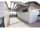Expansive rooftop deck with a pergola, providing an inviting space for outdoor living and entertaining at 8722 E 47Th Ave, Denver, CO 80238