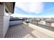 An open rooftop deck with a railing offering a scenic view of the community at 8722 E 47Th Ave, Denver, CO 80238