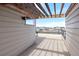 A spacious rooftop deck features a pergola and offers panoramic views of the surrounding community at 8722 E 47Th Ave, Denver, CO 80238