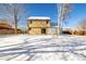 House backyard view with snow on the ground at 1506 Maple Dr, Berthoud, CO 80513