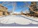 Spacious backyard, partially covered in snow at 1506 Maple Dr, Berthoud, CO 80513