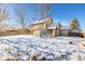 House backyard view covered in snow at 1506 Maple Dr, Berthoud, CO 80513