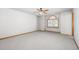 Bedroom with ceiling fan and arched window at 1506 Maple Dr, Berthoud, CO 80513