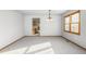 Bright dining room with neutral walls and kitchen access at 1506 Maple Dr, Berthoud, CO 80513