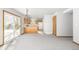 Bright dining room with kitchen access and sliding door to backyard at 1506 Maple Dr, Berthoud, CO 80513