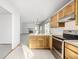 Kitchen with view into living room and fireplace at 1506 Maple Dr, Berthoud, CO 80513