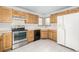 View of stainless steel appliances and corner sink in kitchen at 1506 Maple Dr, Berthoud, CO 80513