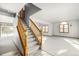 Elegant wooden staircase leading to upper level at 1506 Maple Dr, Berthoud, CO 80513