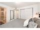 Bright bedroom with ensuite bathroom access and mirrored closet doors for added convenience at 13744 E Lehigh Ave # B, Aurora, CO 80014