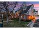 Charming condo featuring a mix of brick and siding, complemented by lush landscaping and mature trees at 13744 E Lehigh Ave # B, Aurora, CO 80014