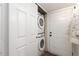 Convenient laundry area with stacked washer and dryer, and closet for storage at 13744 E Lehigh Ave # B, Aurora, CO 80014
