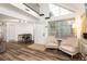 Bright living room featuring a high ceiling with large windows and modern flooring at 13744 E Lehigh Ave # B, Aurora, CO 80014