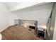Bright loft space with vaulted ceilings overlooks the lower level of the home at 13744 E Lehigh Ave # B, Aurora, CO 80014