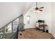 Upstairs office area with a ceiling fan, desk, dual monitors, and natural lighting at 13744 E Lehigh Ave # B, Aurora, CO 80014
