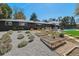 Lovely backyard featuring garden beds and a view of modern townhomes at 8540 W 59Th Ave, Arvada, CO 80004