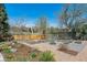 Landscaped backyard with gravel paths and garden beds at 8540 W 59Th Ave, Arvada, CO 80004