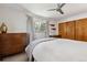 Bedroom with ceiling fan, natural light from window, and closet at 8540 W 59Th Ave, Arvada, CO 80004