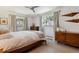 Bedroom featuring large windows, neutral decor, and a ceiling fan at 8540 W 59Th Ave, Arvada, CO 80004