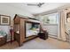 Bedroom with built in bunkbeds, and natural light from a large window at 8540 W 59Th Ave, Arvada, CO 80004