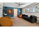 Spacious living room with designer furniture, neutral color palette, and lots of natural light creates an airy atmosphere at 8540 W 59Th Ave, Arvada, CO 80004