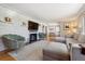 Inviting living room features a fireplace, stylish furniture and hardwood floors at 8540 W 59Th Ave, Arvada, CO 80004