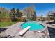 Backyard pool with a diving board, lounge chairs, and a well-manicured lawn at 8540 W 59Th Ave, Arvada, CO 80004